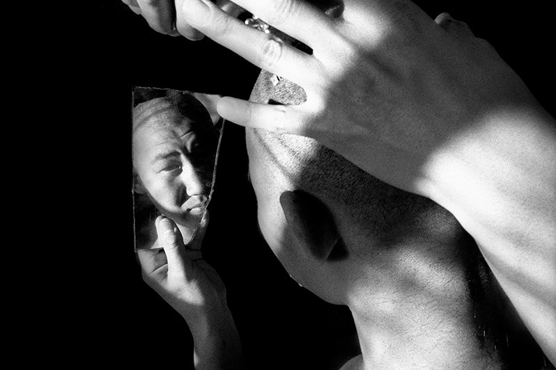 Portrait of a young Buddhist with shaved head, Verkhnyaya Ivolga village, Buryatia, Russia. November 2001