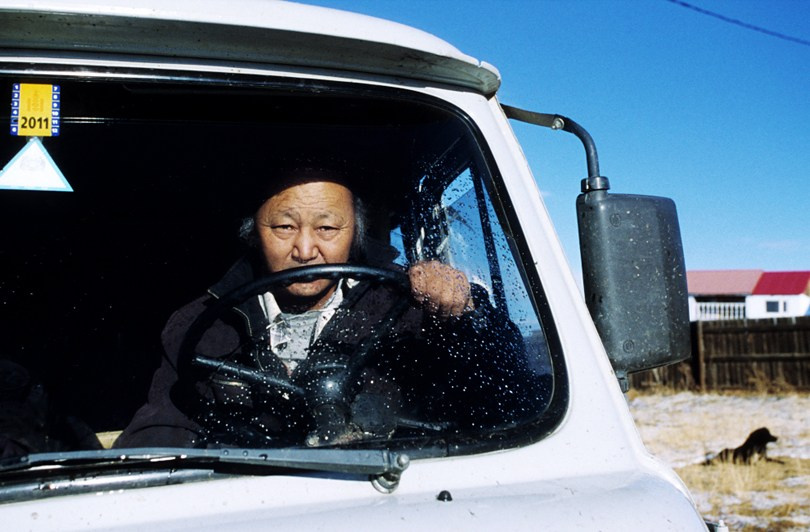Mongol behind the wheel of his ‘Bukhanka’, Tsagaan-Üür district, Khövsgöl province, Mongolia. October 2010