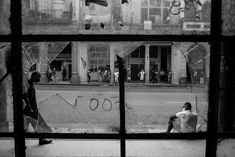 Cityscape through the window of an old building on Reina street, Centro Habana district, Havana, Cuba. 2020