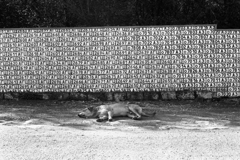 Wall of car licence plates of former Azerbaijan SSR, Vank village, Martakert district, Nagorno-Karabakh Republic. October 2006