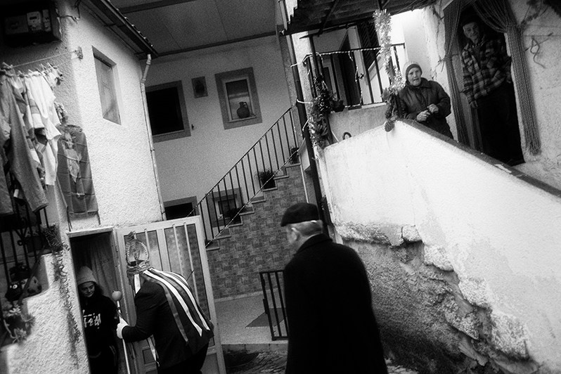 The “Rei” carefully entering a village house due to the size of his crown, Mirandela municipality, Bragança district, Trás-os-Montes region, Portugal. 2023