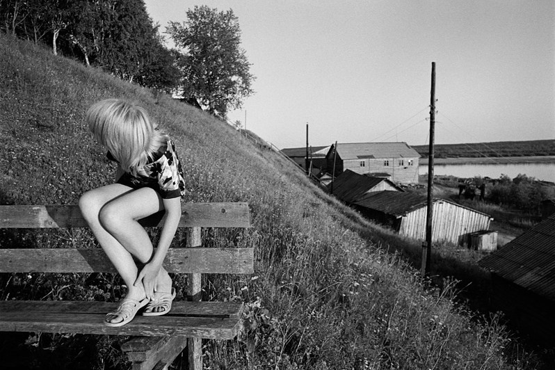 On a bench, Verkhnyaya Toyma, Arkhangelsk region, Russia. 2010
