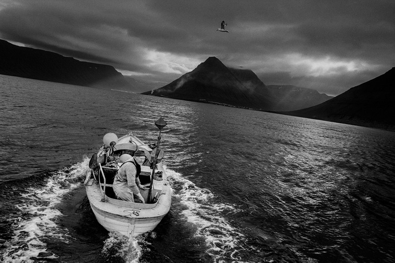 Eyjólfur Guðmundur Ólafsson health by taking his old wooden fishing boat—called Rúna after his wife—out on the water, near Isafjordur, Westfjords region, Iceland. 1995