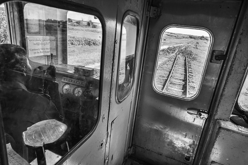 Train travelling between the Rohingya IDP camps, guarded by heavily armed police forces, near Sittwe, Rakhine state, Myanmar. September 2019