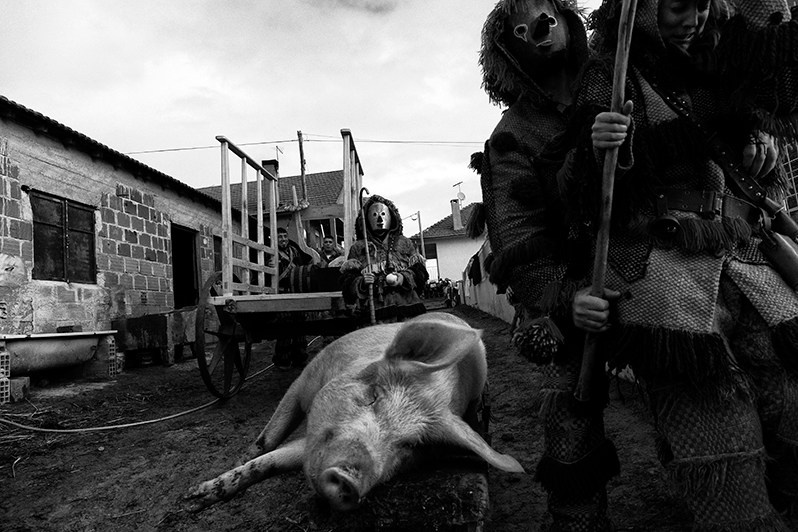A “Careto” tries to scare a girl who masked as “Careto” for the first time, Bragança municipality, Bragança district, Trás-os-Montes region, Portugal. 2018