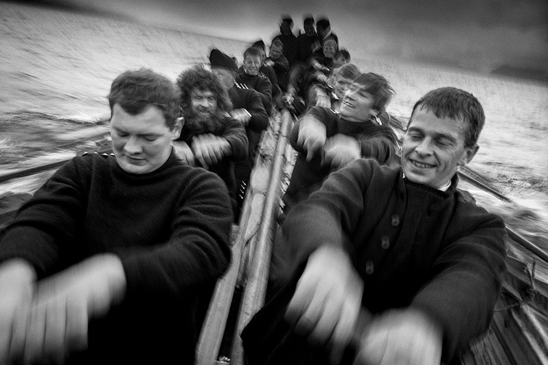 Hunters sailing in a rowboat for a birthday party on the small island of Koltur, near Koltur island, Streymoy region, Faroe Islands, Kingdom of Denmark. 1997