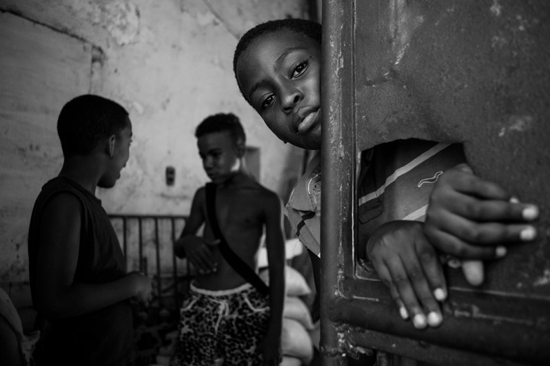 An everyday image of children's pastime inside a building in one of Havana's central neighbourhoods, Centro Habana district, Havana, Cuba. 2017