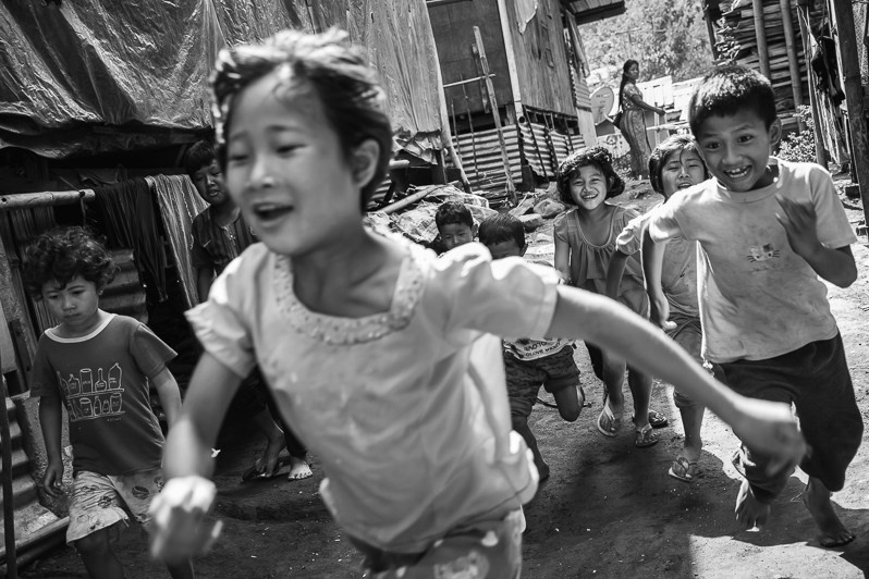 Kachin children playing in an IDP Je Yang camp along the border with China in Kachin Independence Army (KIA) held territory, near Laiza township, Myitkyina district, Kachin state, Myanmar. April 2019