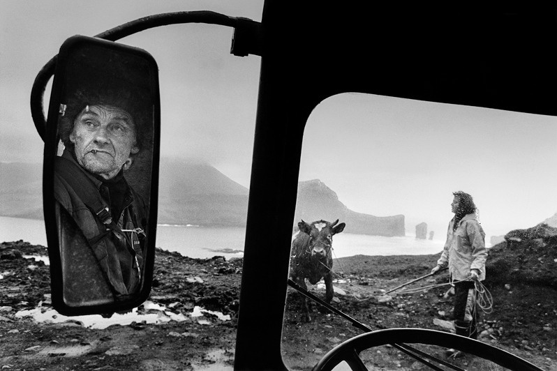 Hanni Mikkelsen and Katrin Rein to get a bull out of the village of Bøur and over to Gásadalur, near Bøur village, Sørvágur municipality, Faroe Islands, Kingdom of Denmark. 1996