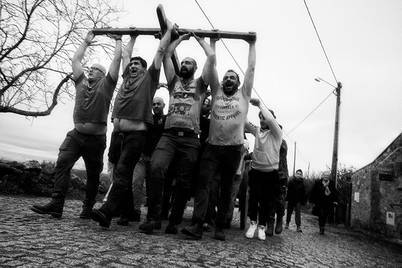 The boys sing and show all their strength pulling the ox cart that transports the “Mordomos” of the Festival and the local authorities, Bragança municipality, Bragança district, Trás-os-Montes region, Portugal. 2022