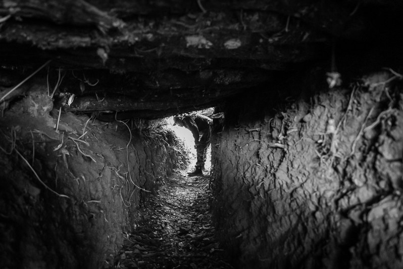 The commander of the local Defence Forces inpecting the defensive lines in the mountains near the access roads leading to central Chin state, Lautu region, Myanmar. September 2022