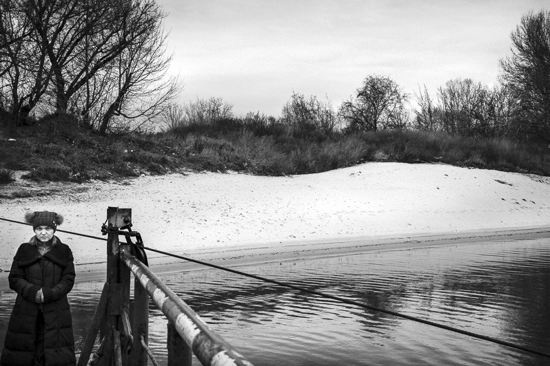Barge crossing the Dniestr river in Tiraspol, Pridnestrovian Moldavian Republic. December 2013