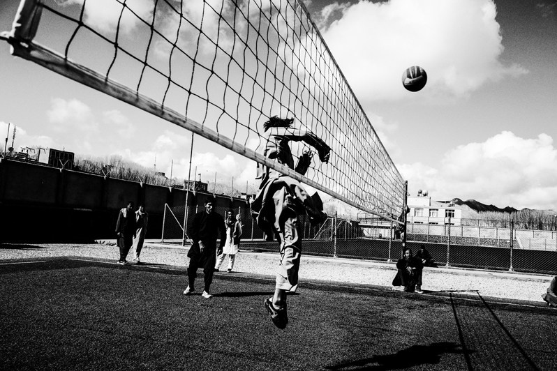 Local youths play volleyball on the city field, Bamyan, Afghanistan. 2024