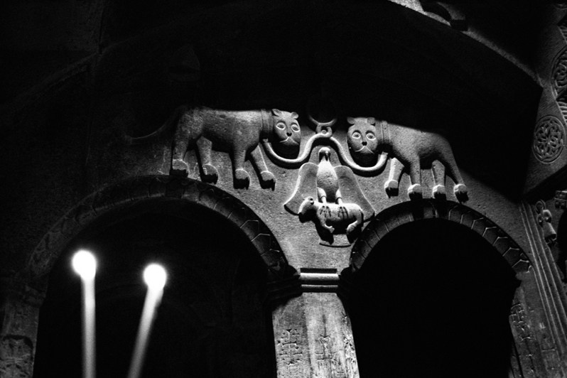 In the rocky temple of Geghard Monastery, Kotayk province, Armenia. October 2006