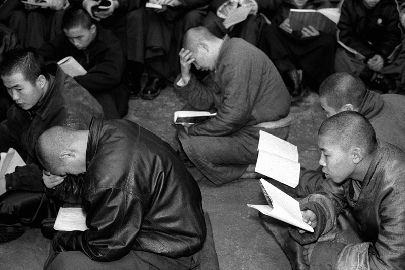 Morning prayer of students in the temple before the start of classes, Verkhnyaya Ivolga village, Buryatia, Russia. November 2001