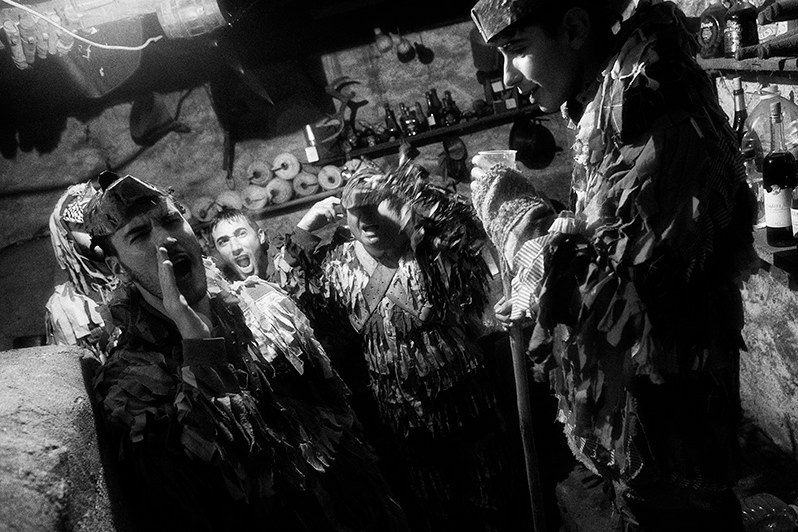 During the “Ronda” the “Caretos” enter the wine cellars to drink wine, dance and sing, Bragança municipality, Bragança district, Trás-os-Montes region, Portugal. 2023
