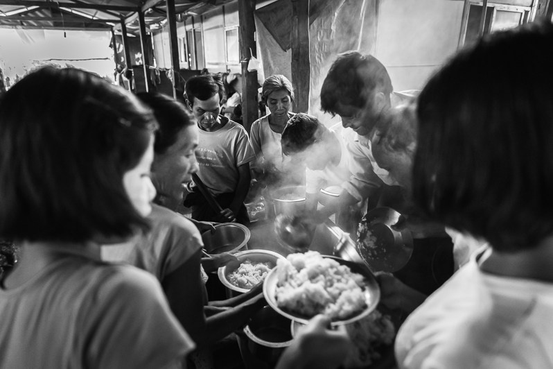 Evening meal prepared in a collective kitchen for the 400 IDPs living in the Chit Thaung Monastery IDP Camp, Mrauk-Oo, Rakhine state, Myanmar. February 2020