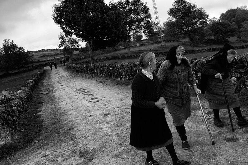 Women on their way from the cemetery talk about their lives, Boticas municipality, Vila Real district, Trás-os-Montes region, Portugal. 2016