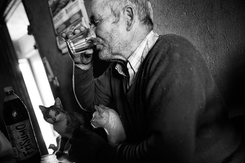 Man drinks a glass of wine after hard work, Boticas municipality, Vila Real district, Trás-os-Montes region, Portugal. 2016