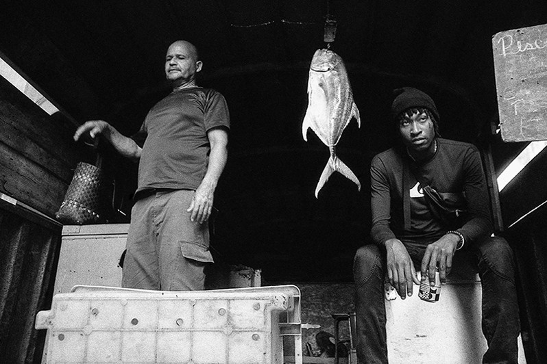 Portrait of fish sellers on San Rafael street, Centro Habana district, Havana, Cuba. 2023