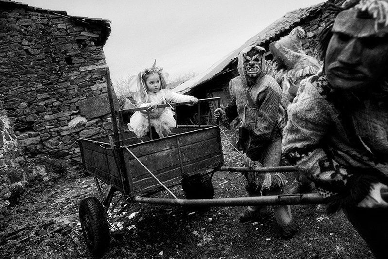 The “Máscaros” ride a girl in a trailer, Vinhais municipality, Bragança district, Trás-os-Montes region, Portugal. 2019