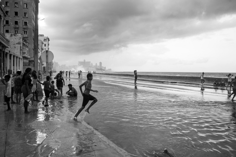 Locals travelled to the Malecon to refresh themselves with seawater that flooded the seafront in the aftermath of Hurricane Ian, Centro Habana district, Havana, Cuba. 2022
