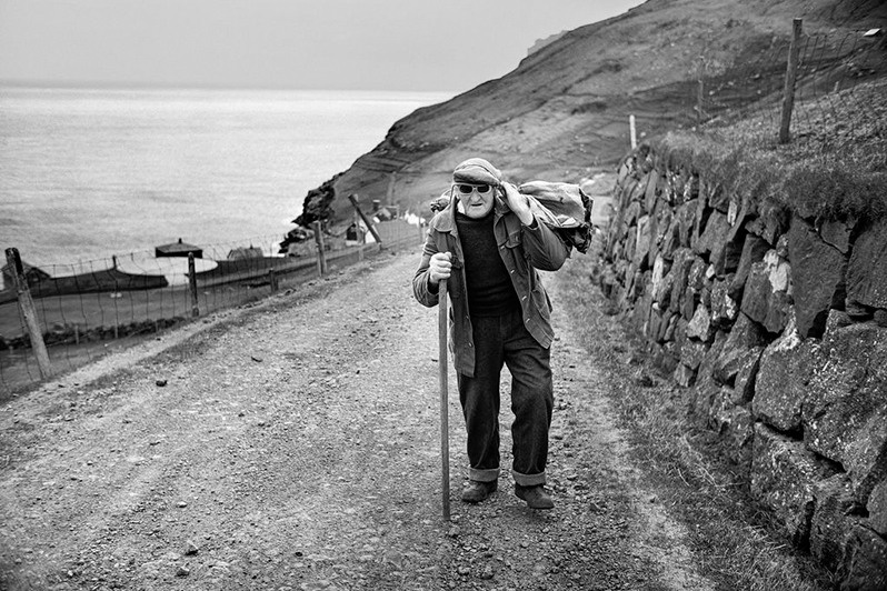 “A little firewater doesn’t do any harm during all the commotion of the day”. Guttorm, Hattarvik village, Fugloyar municipality, Faroe Islands, Kingdom of Denmark. 1988