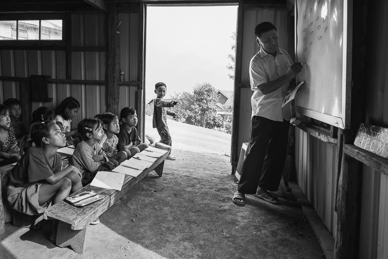 School classes held under random houses for fear that schools would be targetted by airstrikes as has been the case repeatedly throughout Chin state, Leilet village in Falam township, Myanmar. June 2023