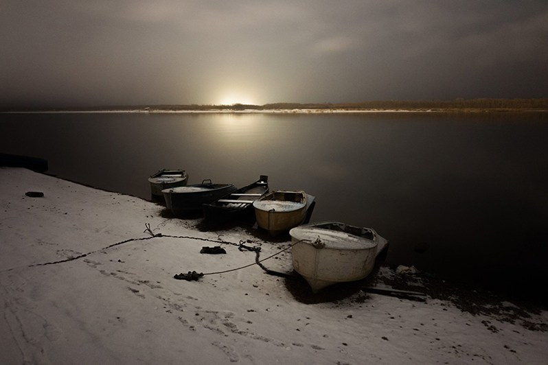 Boats on the banks of Vashka River, one of the smaller rivers flowing into Mezen, Leshukonskoe village, Arkhangelsk region, Russia. October 2017