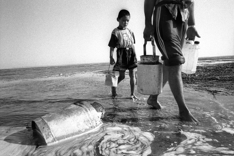 Drinking water?, Koszhar village, Aralsk district, Kyzyl-Orda region, Kazakhstan. August 2001