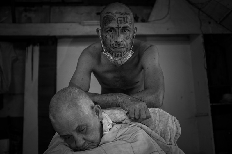 Portrait of Alain and his sick mother during quarantine due to the Covid 19 pandemic, Centro Habana district, Havana, Cuba. 2020