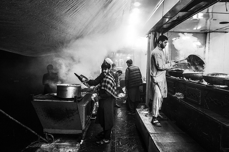In the evening, city dwellers come to the main streets to eat meat, Shur Bazar, Kabul, Afghanistan. 2024