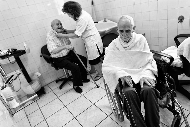 Haircut and shave in nursing home, Bragança district, Trás-os-Montes region, Portugal. 2015