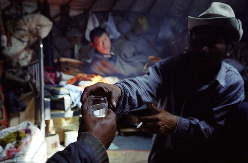 A glass of vodka for guests is the norm, Khövsgöl province, Mongolia. September 2009