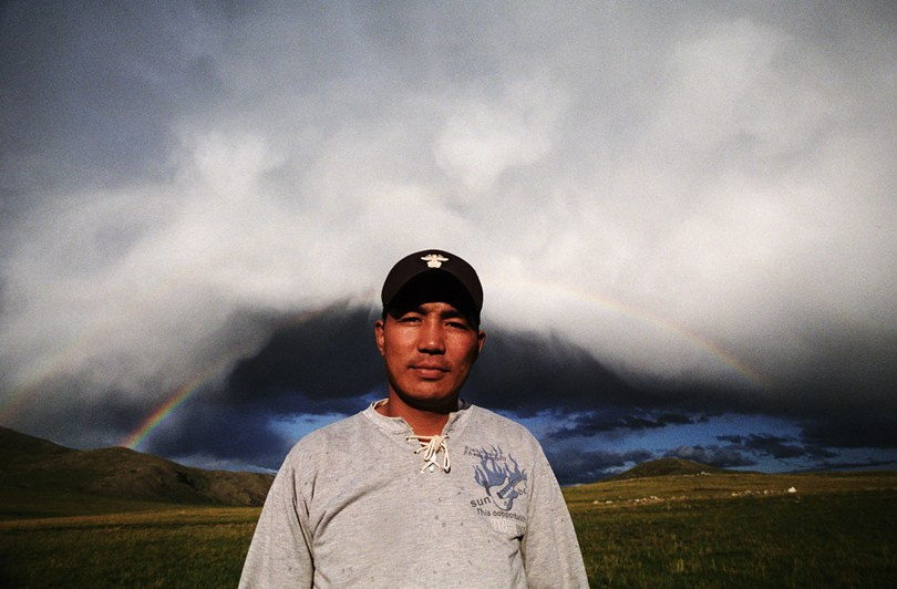 Baggi against a rainbow, Khövsgöl province, Mongolia. September 2009