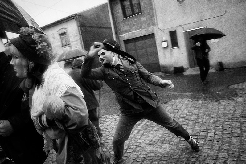 The “Soldado” whips his belt very hard at an inhabitant of the village who tried to escape with his wife, “Sécia”, Mogadouro municipality, Bragança district, Trás-os-Montes region, Portugal. 2022