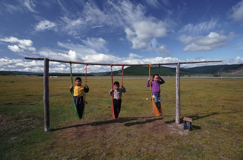 Kids playing in the steppe, Ulaan-Uul district, Khövsgöl province, Mongolia. September 2009