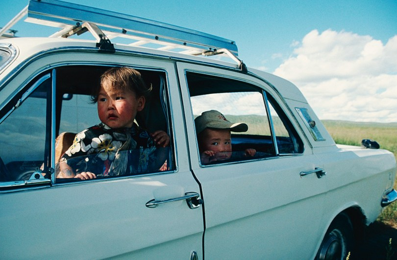 Broken old 'Volga' car on the Steppe, Arkhangai province, Mongolia. July 2003