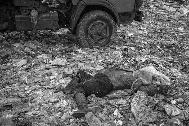 A homeless woman who died at a rubbish tip whilst a refuse lorry was being unloaded automatically, near Salaryevo village, Leninsky district, Moscow region, Russia. 2007 © Oleg Klimov