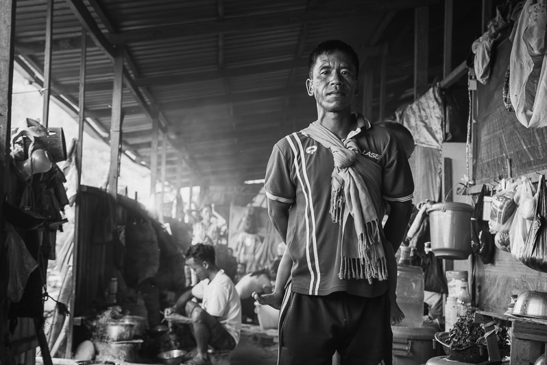 Chin Refugee and his child in a refugee shelter along the Indian Burmese border, Zokhawthar village, Champhai district, Mizoram state, India. May 2023