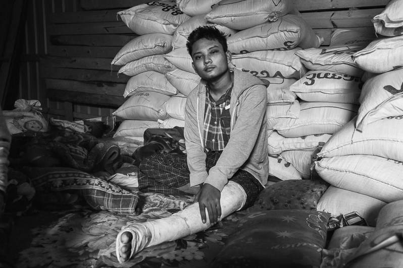 Bawi, 24 years, recently injured on the front-line by sharpnel wounds. He is part of the People Defence Forces (PDF), PDF safehouse in Lautu region, Chin state, Myanmar. September 2022