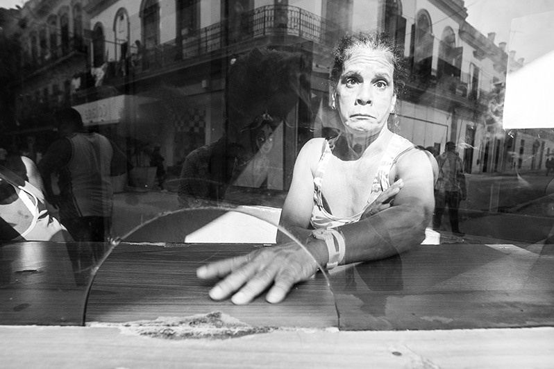 Portrait of a female cashier at a cinema on San Rafael boulevard, Centro Habana district, Havana, Cuba. 2016