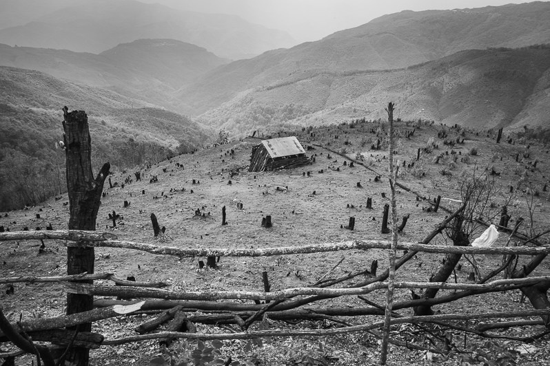 Deforestation and land burning for agriculture purposes around villages in Chin state, Falam township, Chin state, Myanmar. June 2023