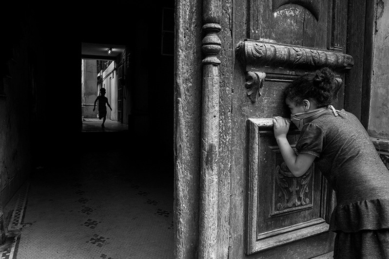 Children are forced to play in their communities after parks and other recreational facilities are closed as the pandemic spreads, Centro Habana district, Havana, Cuba. 2020