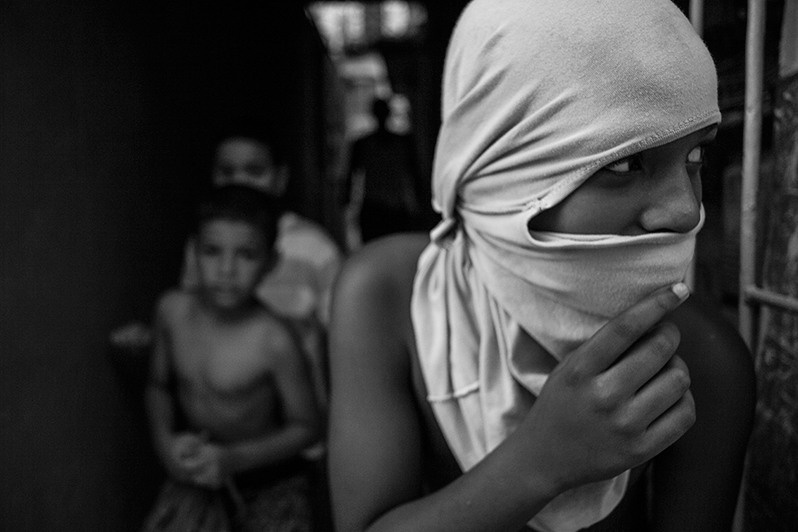 Children play "cops and robbers" inside a building on a street in the centre of Havana, Centro Habana district, Havana, Cuba. 2017