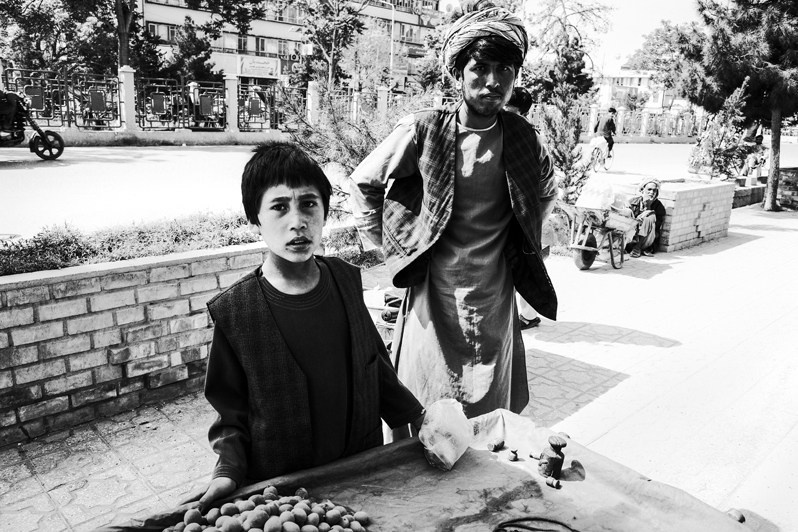 Young chestnut sellers, Mazar-i-Sharif, Balkh province, Afghanistan. 2024