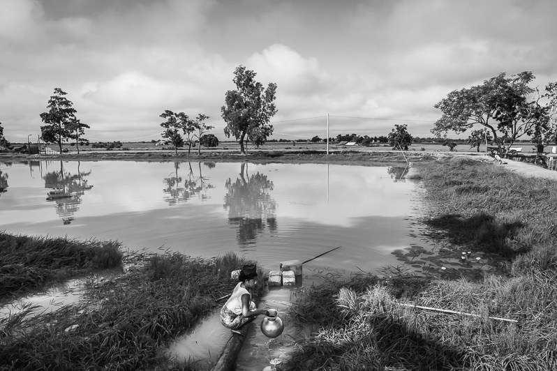 The pond is the only source of water for the Thein Nyo IDP Camp and its 3,000 residents, Mrauk-Oo township, Rakhine state, Myanmar. October 2019