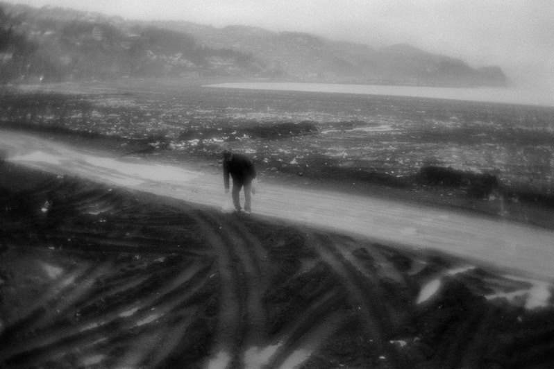 Man is gathering the coal on the beach, around the city of Zonguldak, Turkey. January 2008
