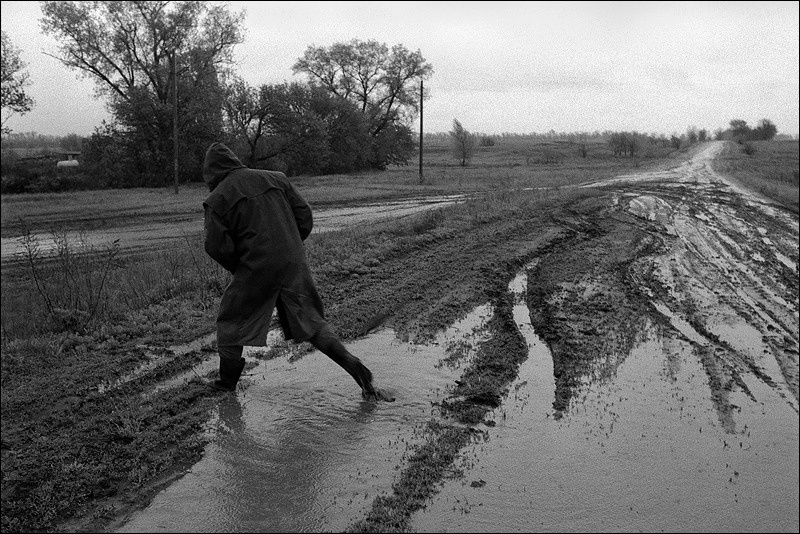 "Through the puddings of the country road", farm of Senshin, village of Oblivskaya district, Rostov-on-Don region, Russia, May 2011