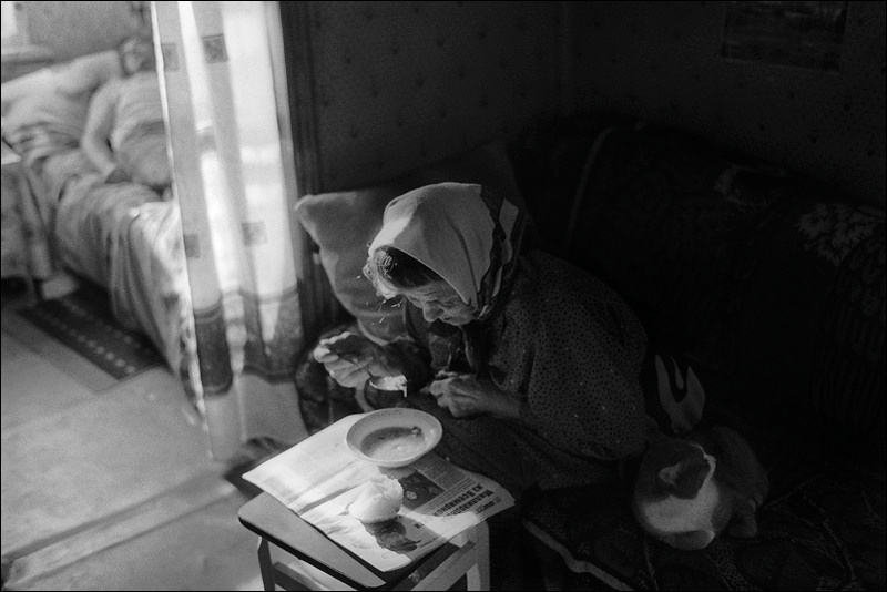 "A bowl of soup on a newspaper", farm of Senshin, village of Oblivskaya district, Rostov-on-Don region, Russia, January 2011
